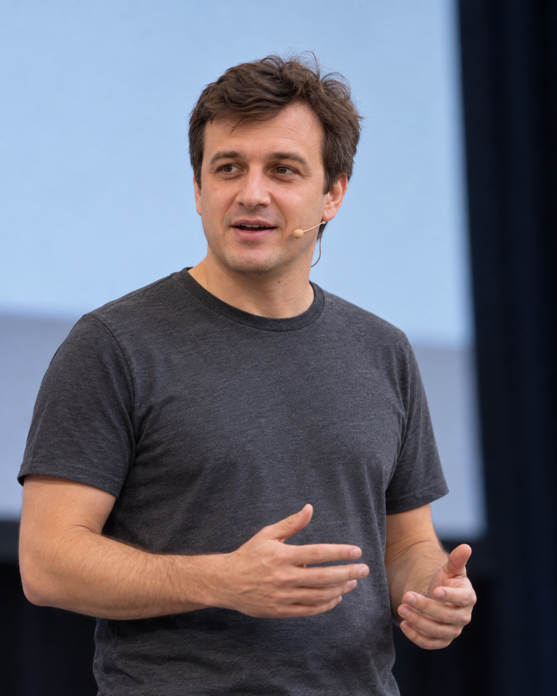 Pavel speaking on stage